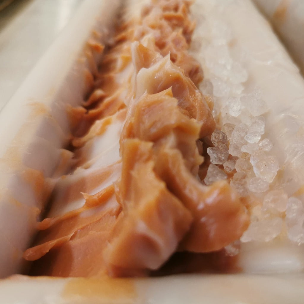 A close-up view of the Candy Cane Bar Soap from Bubbles &amp; Balms.