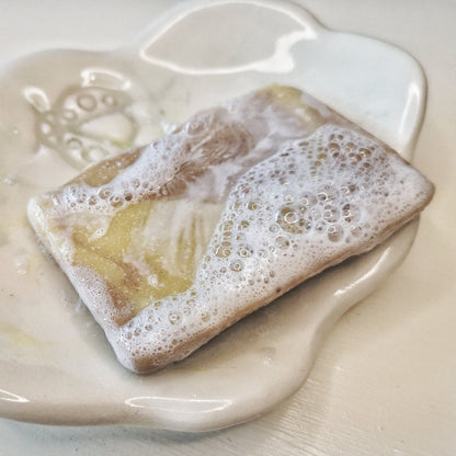 Lathered Fresh Cedar soap on a Bubbles &amp; Balms soap dish.